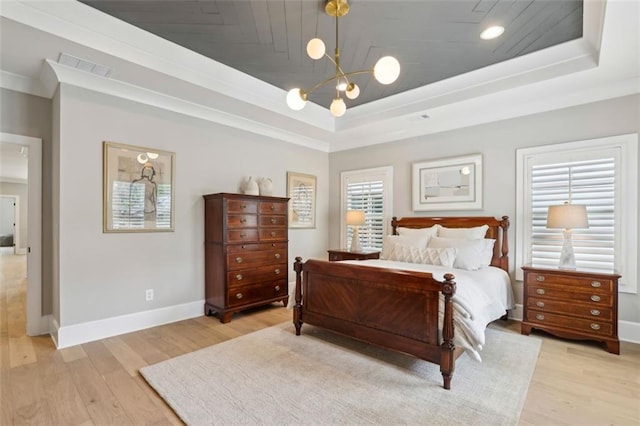 2583 Apple Valley Rd, Brookhaven, GA 30319 - bedroom with a raised ceiling, a chandelier, light wood-style flooring, baseboards, and crown molding