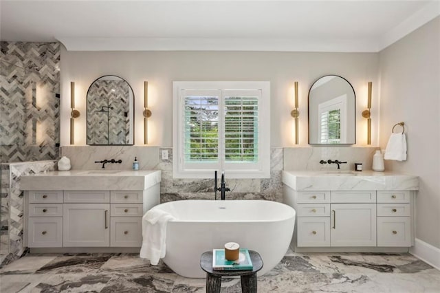 2583 Apple Valley Rd, Brookhaven, GA 30319 - bathroom with marble finish flooring, tile walls, a freestanding bath, and two vanities