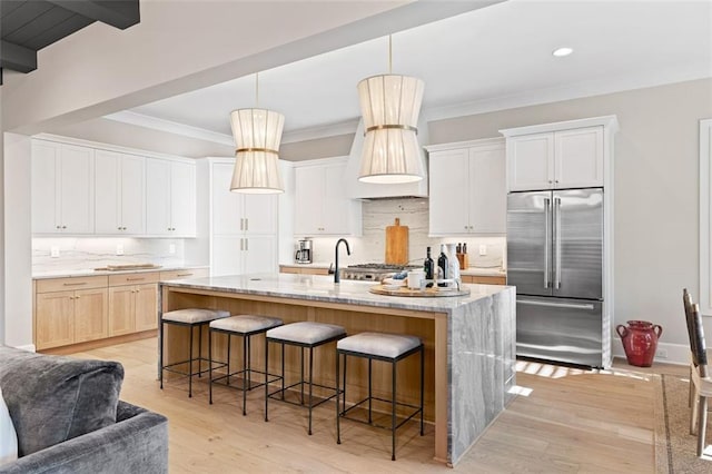 2583 Apple Valley Rd, Brookhaven, GA 30319 - kitchen featuring stainless steel built in fridge, tasteful backsplash, a kitchen breakfast bar, light wood-style flooring, and recessed lighting