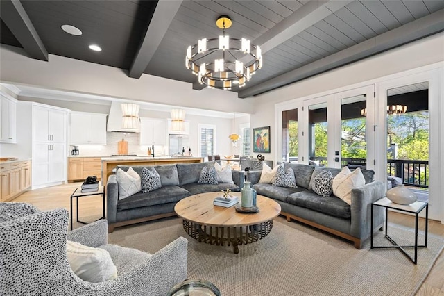 2583 Apple Valley Rd, Brookhaven, GA 30319 - living room featuring beam ceiling, light wood finished floors, a chandelier, french doors, and wooden ceiling