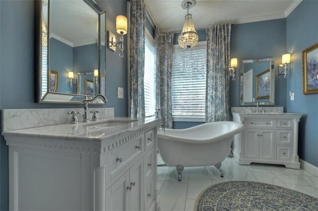 bathroom with a sink, marble finish floor, baseboards, and crown molding