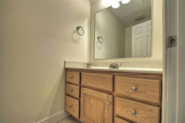 bathroom featuring vanity and baseboards