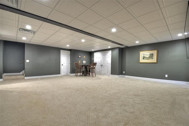 below grade area with carpet floors, baseboards, visible vents, and recessed lighting