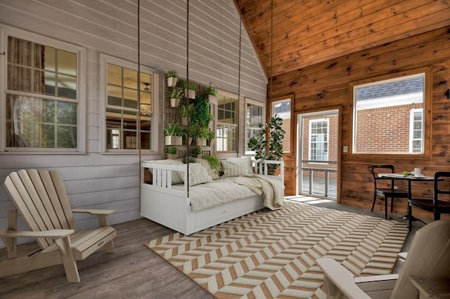 sunroom / solarium with lofted ceiling and wooden ceiling