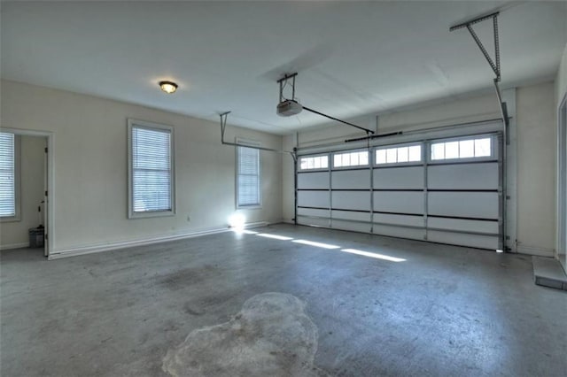 garage featuring baseboards and a garage door opener