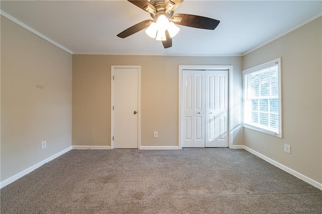 unfurnished bedroom with crown molding, ceiling fan, and carpet floors