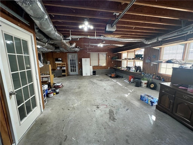 1958 Stonewood Dr, Lithia Springs, GA 30122 - garage featuring a workshop area and a garage door opener