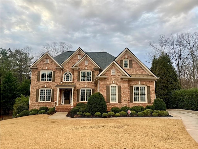 view of front of house featuring brick siding