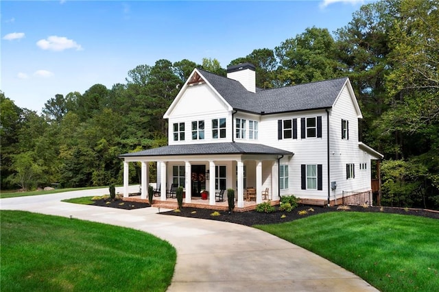 view of front of house with a front lawn and covered porch