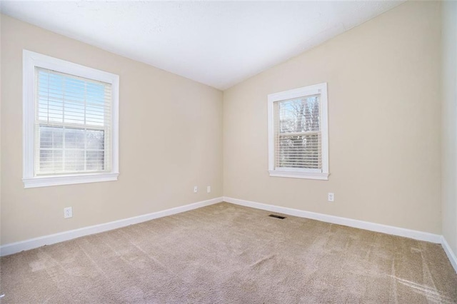 spare room featuring carpet flooring