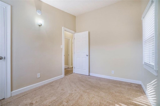 unfurnished bedroom with light carpet