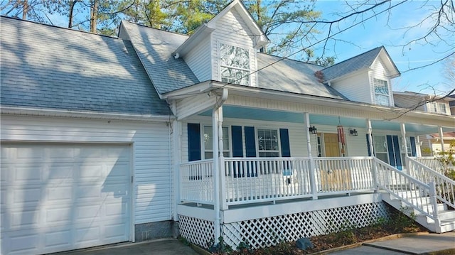 view of front of home featuring covered porch and a garage