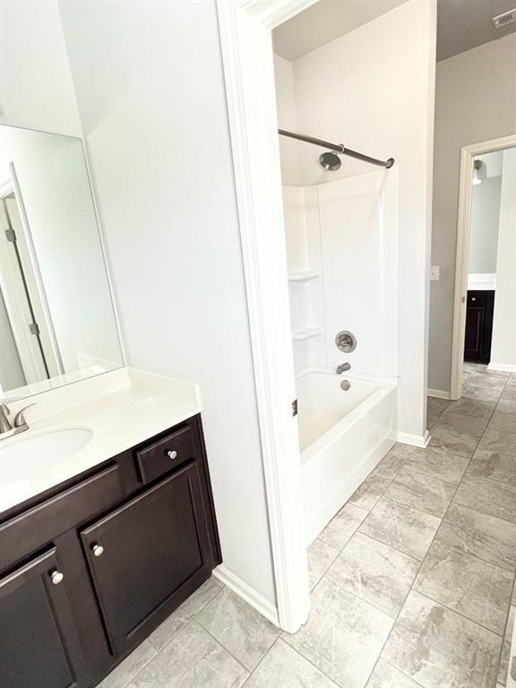 2300 Ivy Birch Ln, Buford, GA 30519 - bathroom featuring vanity and shower / bathtub combination
