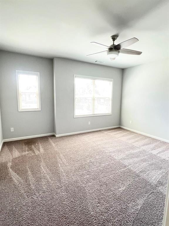 2300 Ivy Birch Ln, Buford, GA 30519 - unfurnished room with plenty of natural light, carpet floors, and ceiling fan