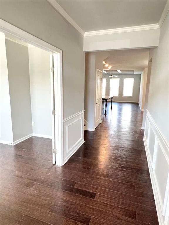 2300 Ivy Birch Ln, Buford, GA 30519 - hallway featuring crown molding and dark wood-style flooring