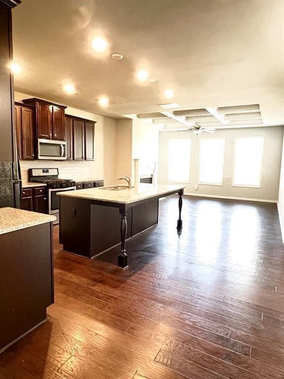2300 Ivy Birch Ln, Buford, GA 30519 - kitchen featuring stainless steel appliances, dark wood finished floors, healthy amount of natural light, ceiling fan, and recessed lighting