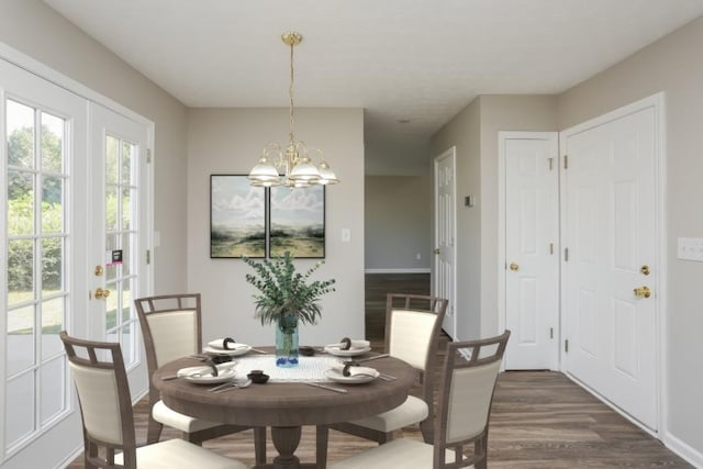 dining area featuring dark wood-type flooring and a chandelier