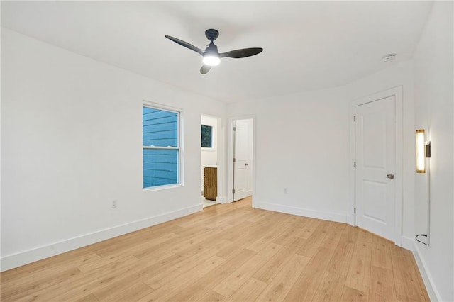 spare room with light hardwood / wood-style floors and ceiling fan