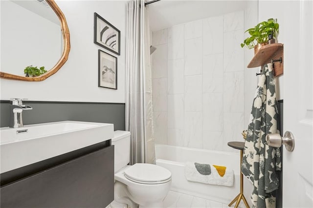 full bathroom featuring tile patterned floors, vanity, toilet, and shower / bathtub combination with curtain