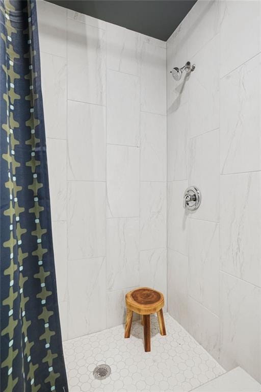 bathroom with a tile shower