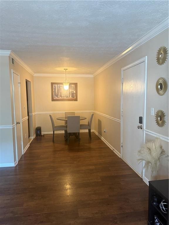 3120 Seven Pines Ct Unit 203, Atlanta, GA 30339 - dining space with dark wood finished floors, a textured ceiling, and ornamental molding