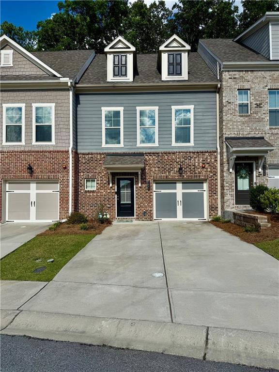1452 Ridgebend Way SE, Mableton, GA 30126 - multi unit property with driveway, a garage, and brick siding