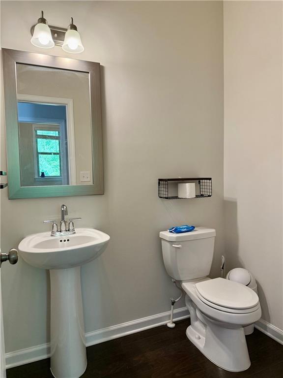 1452 Ridgebend Way SE, Mableton, GA 30126 - bathroom featuring baseboards and wood finished floors