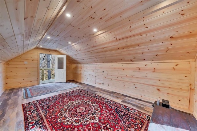 bonus room featuring hardwood / wood-style flooring, lofted ceiling, wood walls, and wood ceiling