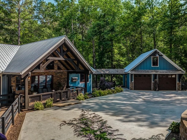 view of front of property with a porch and a garage