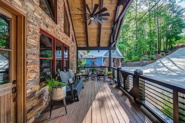 wooden terrace featuring ceiling fan