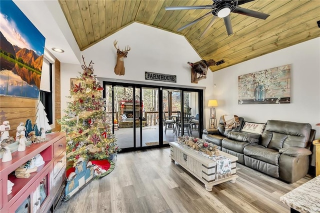 living room with hardwood / wood-style floors, ceiling fan, wood ceiling, and high vaulted ceiling