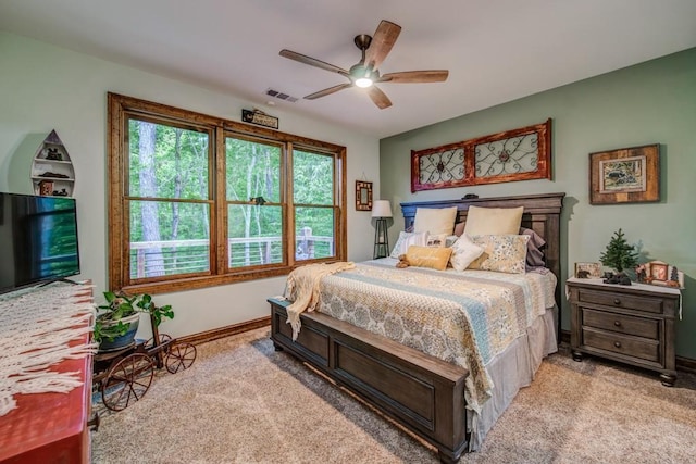 bedroom with light colored carpet and ceiling fan