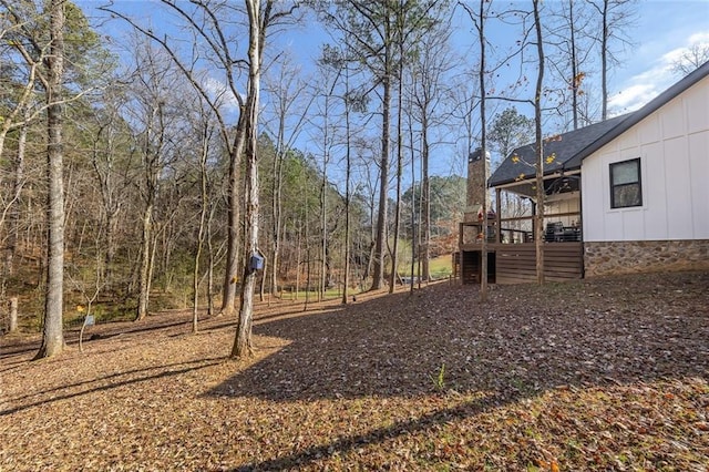 view of yard with a wooden deck