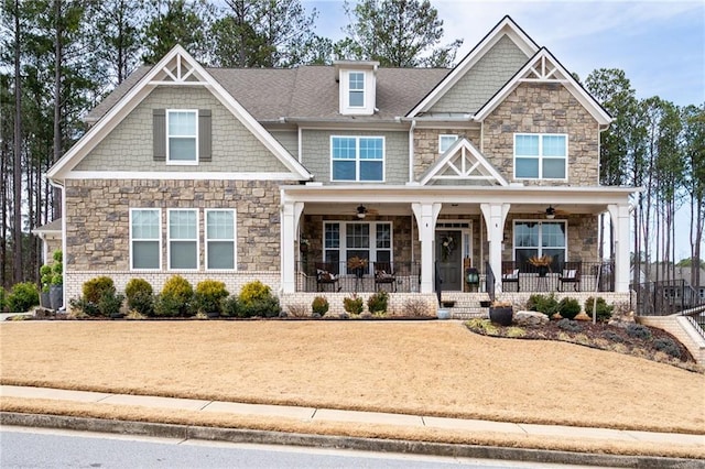 craftsman-style home with ceiling fan and covered porch