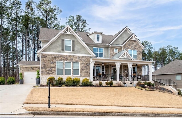 craftsman inspired home featuring a garage and covered porch