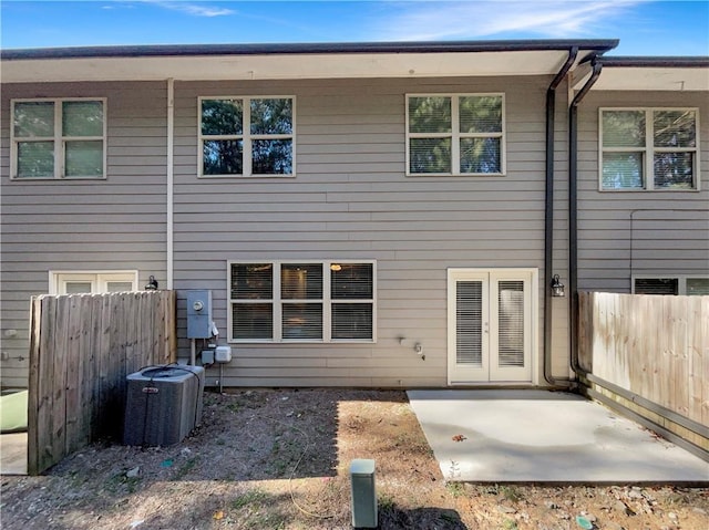 rear view of house featuring a patio and central air condition unit