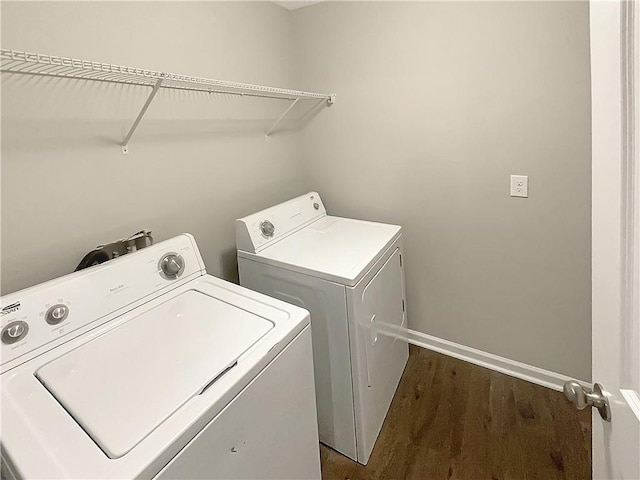 laundry room featuring dark wood-type flooring and washing machine and clothes dryer