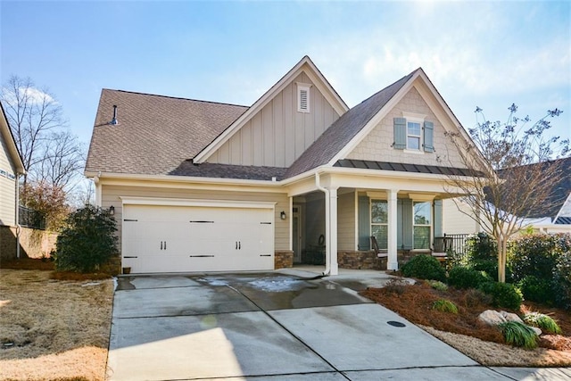 view of front of home featuring a porch and a garage