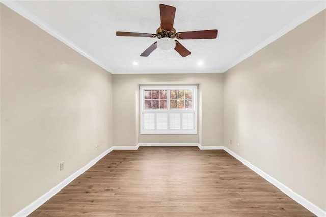 spare room featuring baseboards, wood finished floors, ornamental molding, recessed lighting, and a ceiling fan