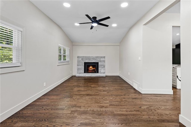1887 Shalimar Dr, Atlanta, GA 30345 - unfurnished living room with lofted ceiling, ceiling fan, dark wood finished floors, recessed lighting, and a stone fireplace