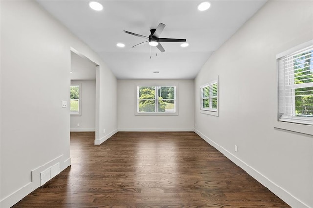 1887 Shalimar Dr, Atlanta, GA 30345 - spare room with healthy amount of natural light, recessed lighting, dark wood-type flooring, ceiling fan, and baseboards