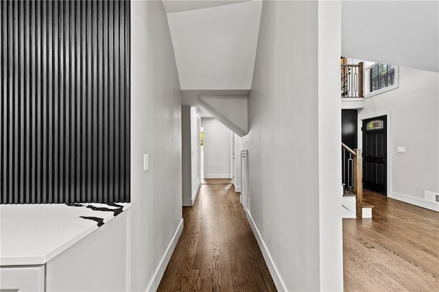 1887 Shalimar Dr, Atlanta, GA 30345 - hall featuring wood finished floors, baseboards, a high ceiling, and stairs