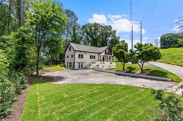 1887 Shalimar Dr, Atlanta, GA 30345 - view of front of house with a front yard, a patio area, and french doors