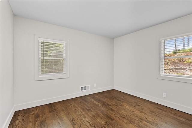 1887 Shalimar Dr, Atlanta, GA 30345 - spare room with healthy amount of natural light, baseboards, and dark wood-style flooring