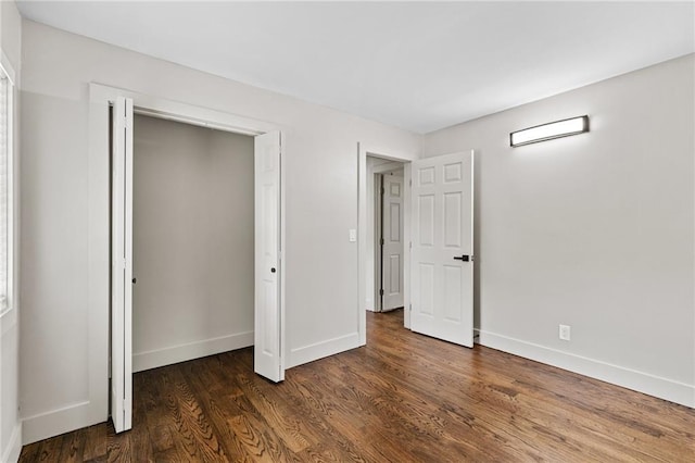 1887 Shalimar Dr, Atlanta, GA 30345 - unfurnished bedroom with baseboards, dark wood-style flooring, and a closet