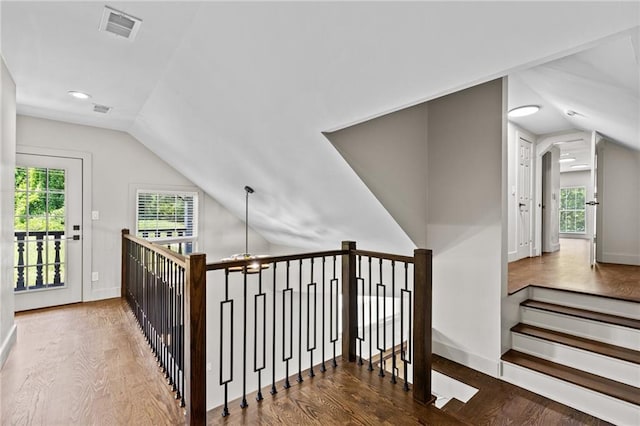 1887 Shalimar Dr, Atlanta, GA 30345 - stairs featuring vaulted ceiling, wood finished floors, baseboards, and recessed lighting