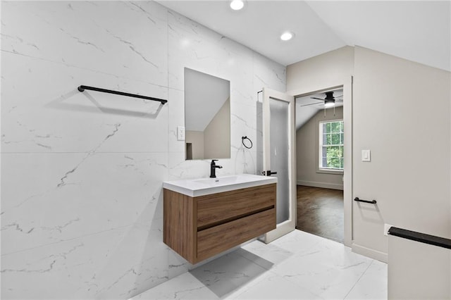1887 Shalimar Dr, Atlanta, GA 30345 - bathroom featuring vanity, vaulted ceiling, recessed lighting, marble finish flooring, and baseboards