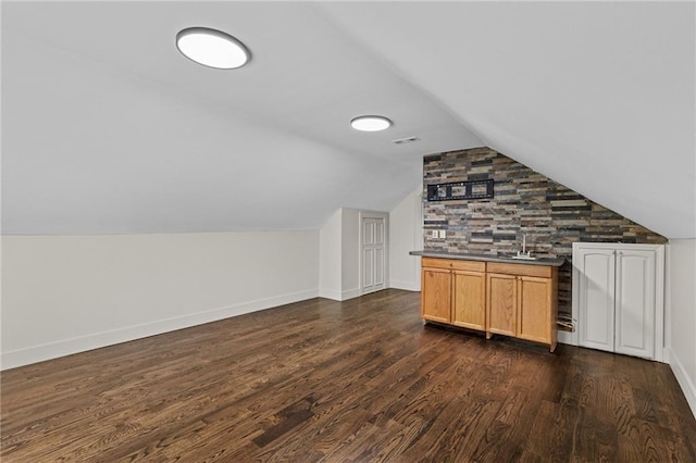 1887 Shalimar Dr, Atlanta, GA 30345 - bonus room featuring dark wood-style floors, vaulted ceiling, and baseboards