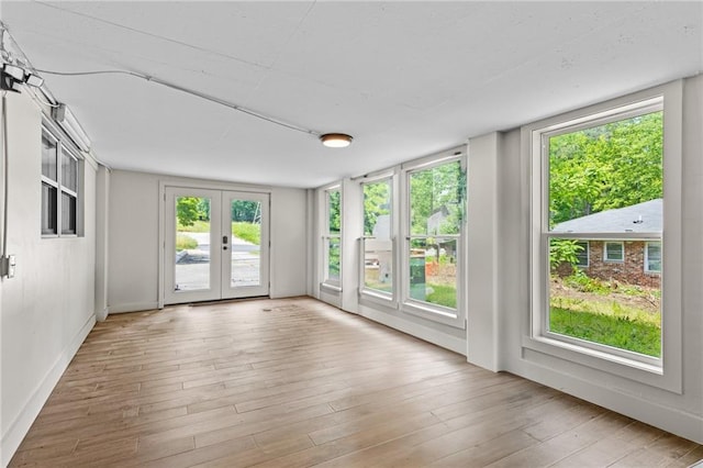1887 Shalimar Dr, Atlanta, GA 30345 - unfurnished sunroom featuring french doors, wood finished floors, and plenty of natural light