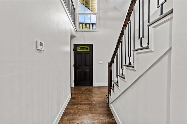 1887 Shalimar Dr, Atlanta, GA 30345 - entryway featuring a high ceiling, stairway, dark wood-style flooring, and baseboards